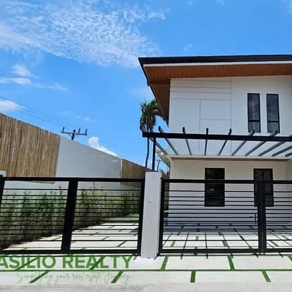 Two-storey home behind a modern gate